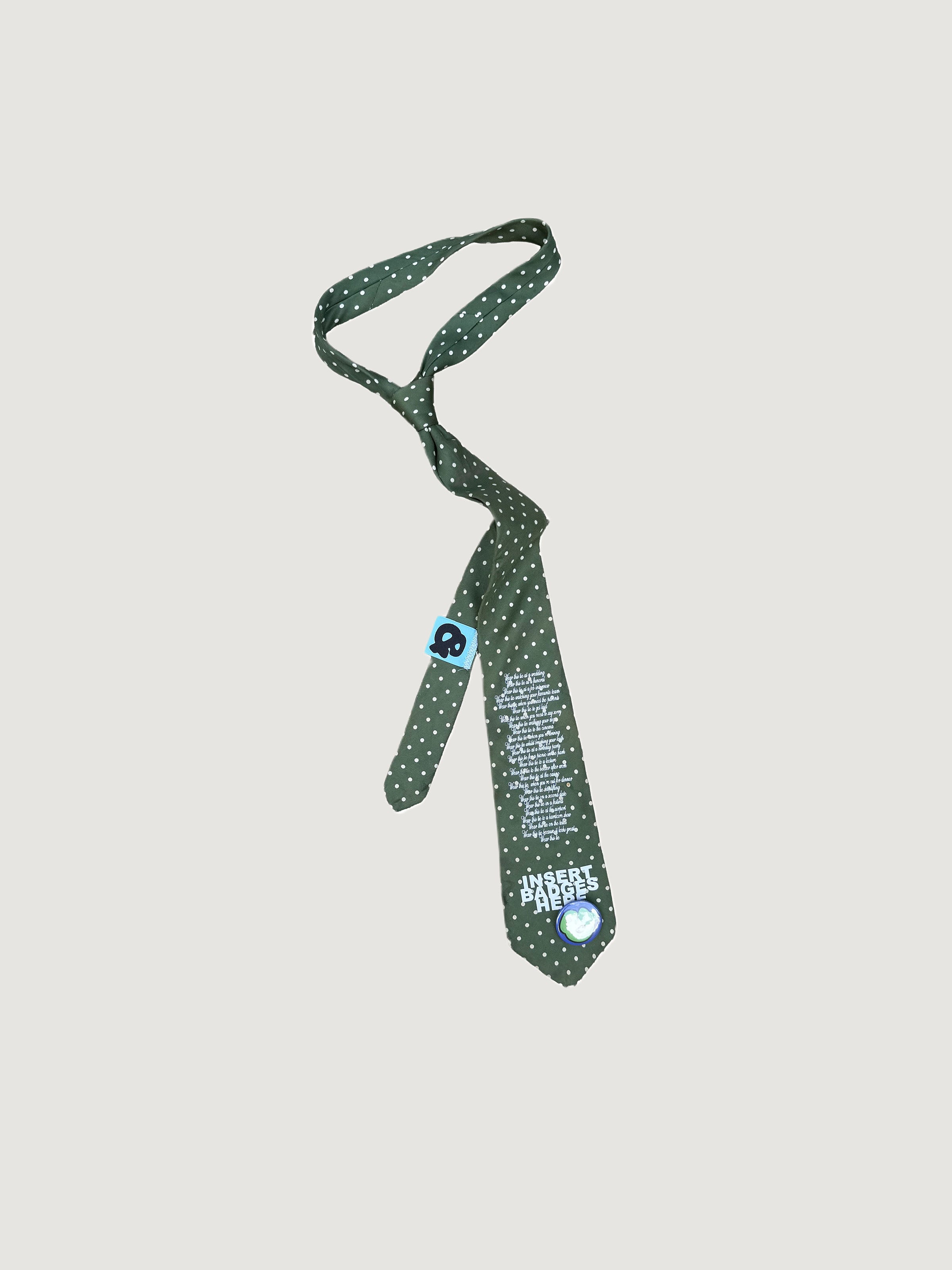 Reworked green polka-dot poem-print tie by andvamos on a grey background
