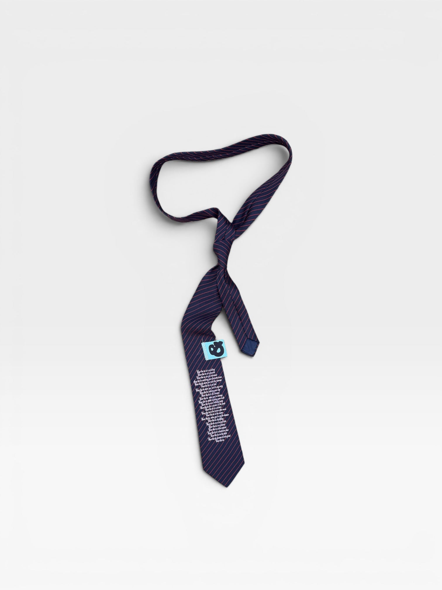andvamos Navy Poem Tie — reworked navy pinstripe tie with poem print