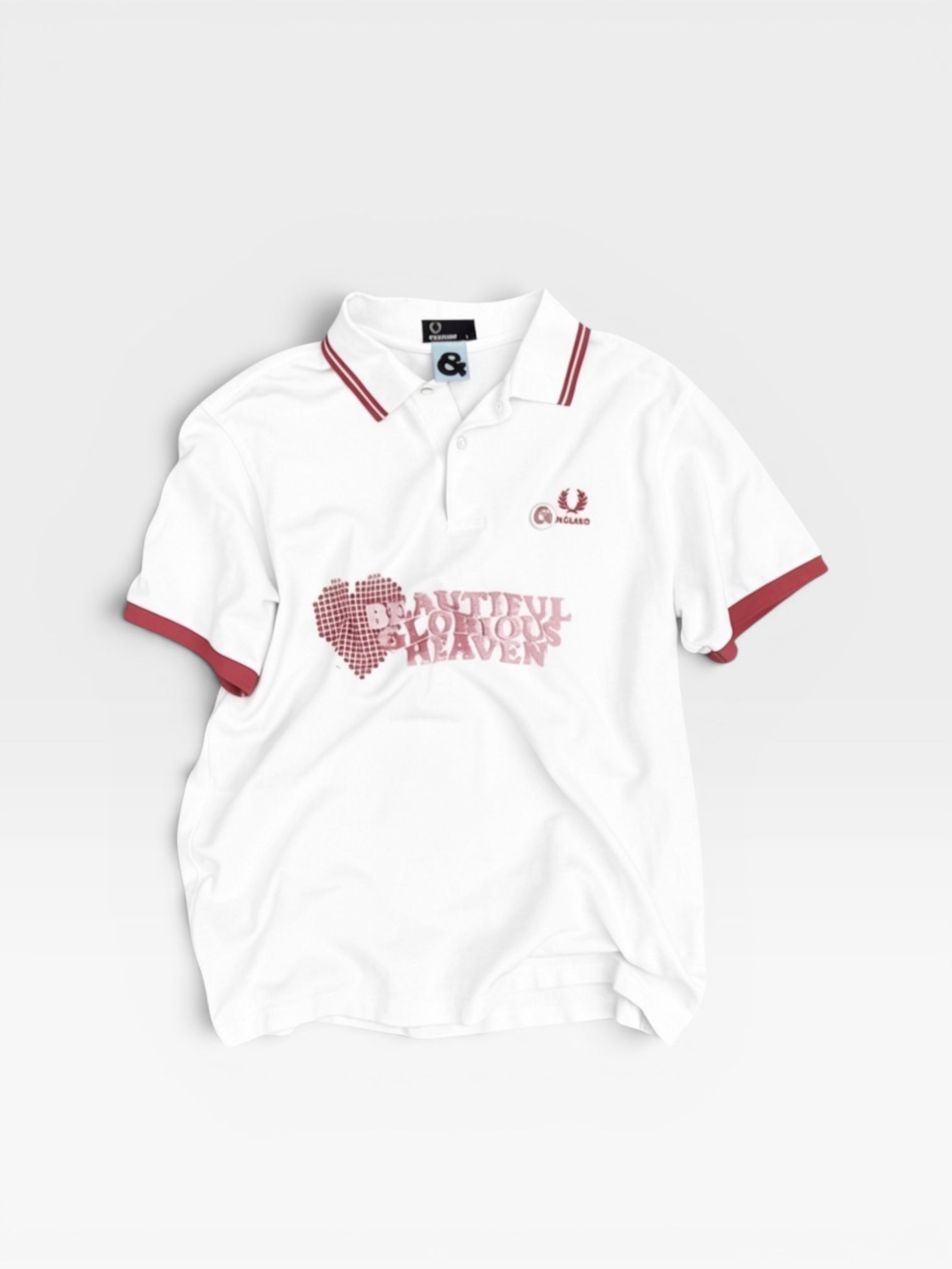 andvamos England Polo — reworked white polo with red collar and sleeve trim and a screen-printed heart graphic, front view