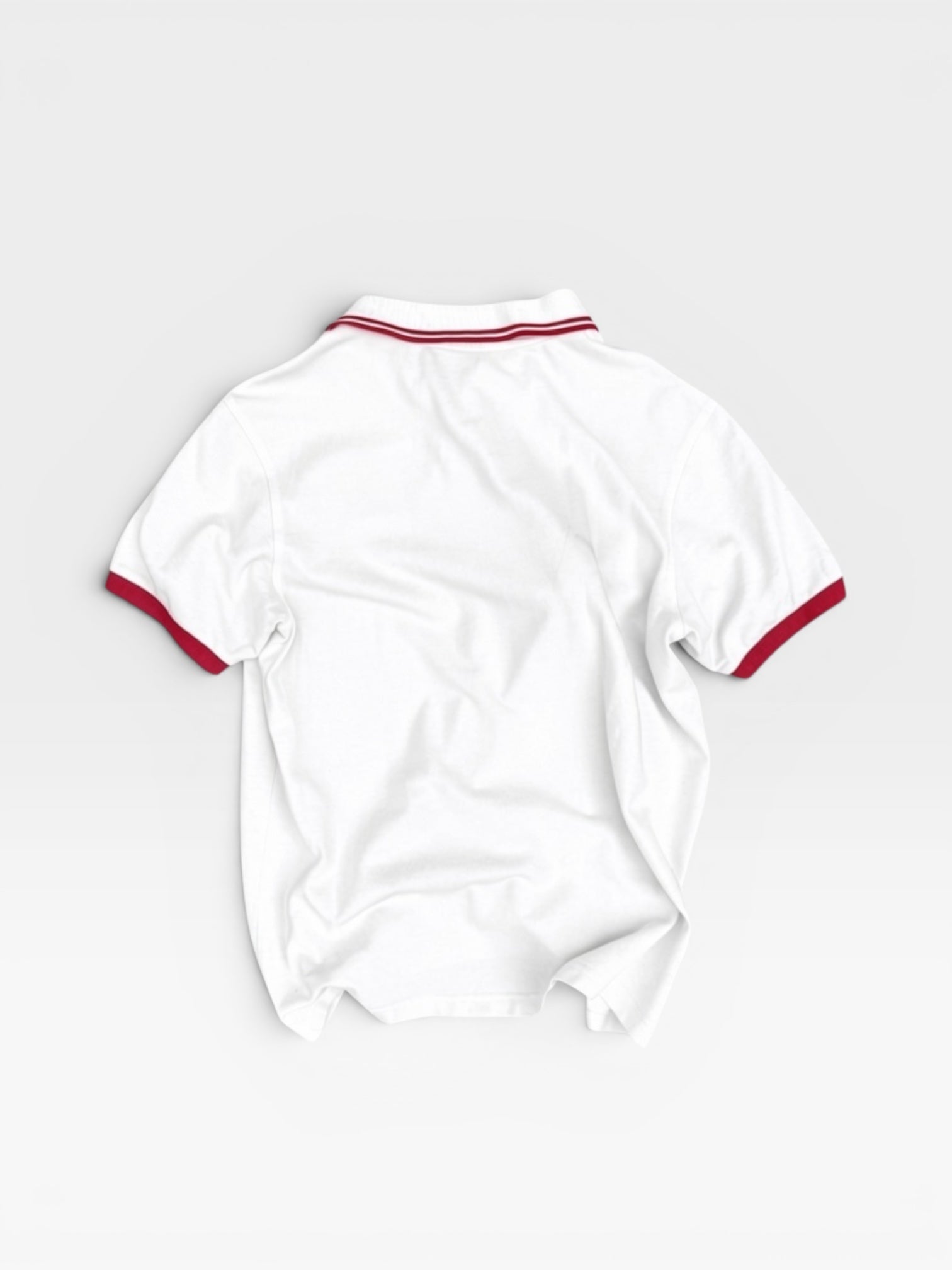 andvamos England Polo — reworked white polo with red trim, detail view