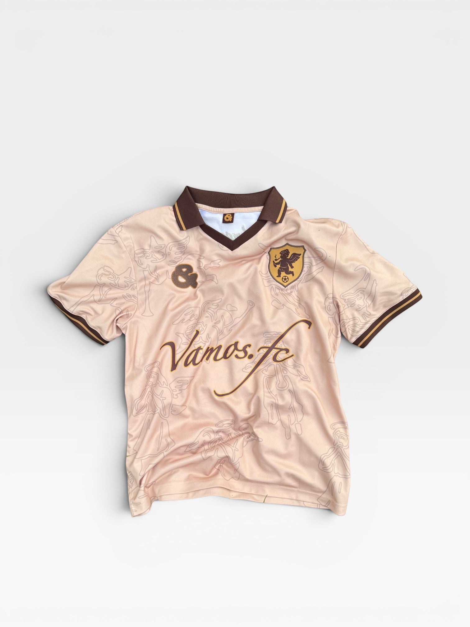 andvamos Footy Shirt front — cream limited-edition numbered football shirt with embroidered &vamos crest, terrace streetwear