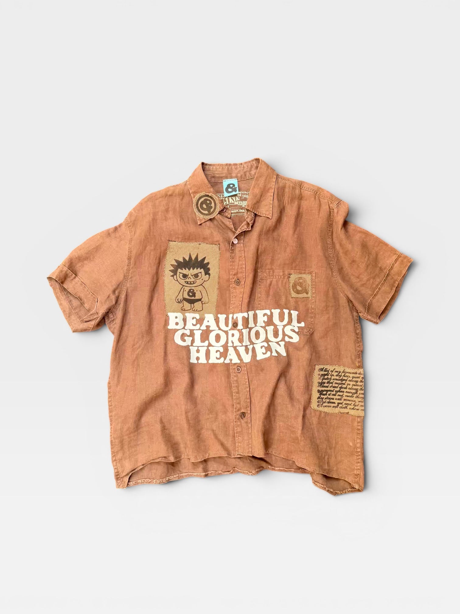 andvamos Heaven Shirt front — reworked terracotta linen shirt with DTF-printed 'Beautiful Glorious Heaven' graphic, one-of-a-kind upcycled streetwear