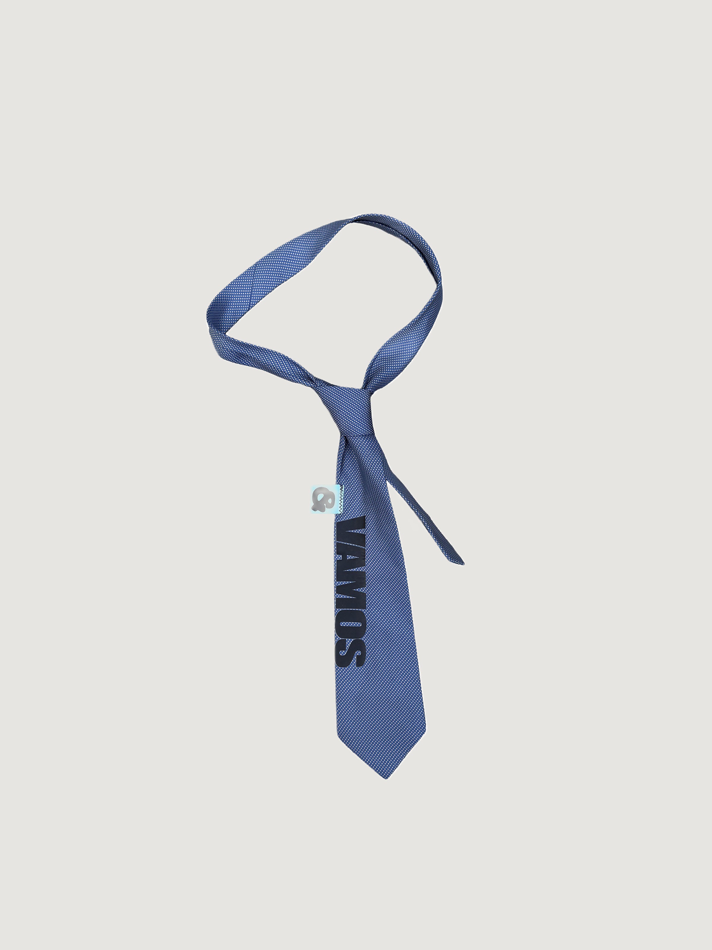 Reworked blue VAMOS signature-print tie by andvamos on a grey background